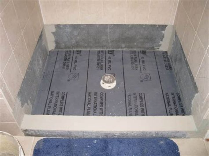How do you put a shower pan liner on?