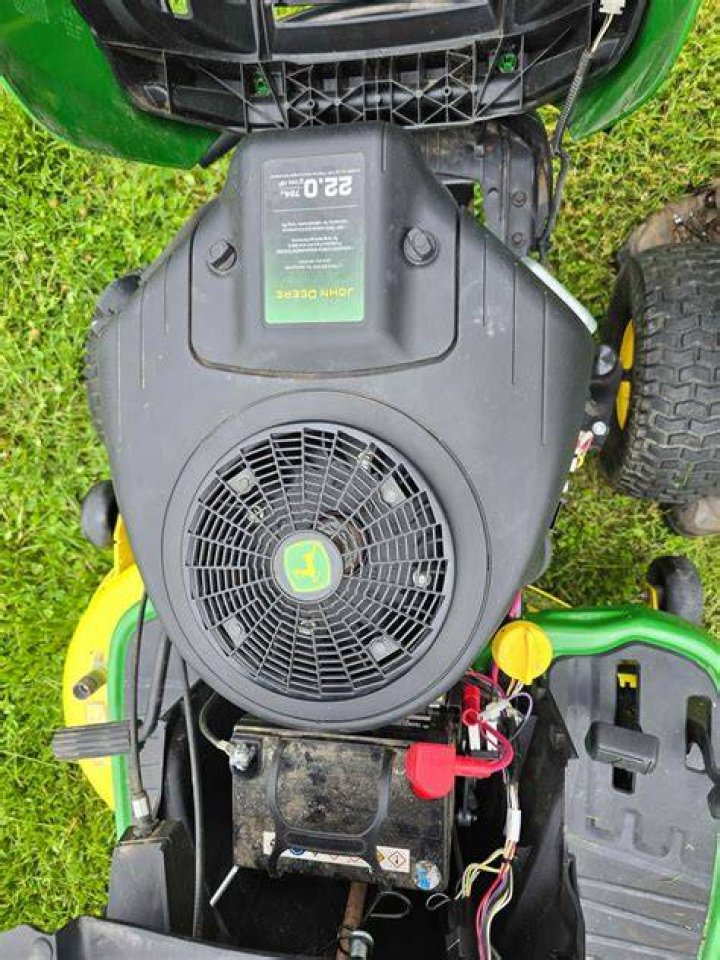 How do you reset the service light on a John Deere e130?